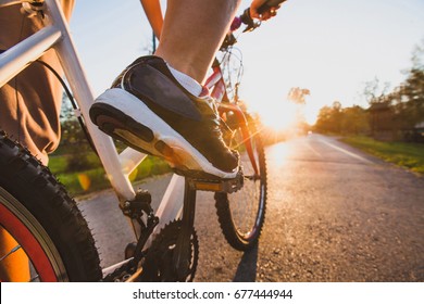 Cycling Outdoors, Close Up Of The Feet On Pedal