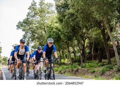 Cycling Peloton Of Different Age Groups On A Mountain Road