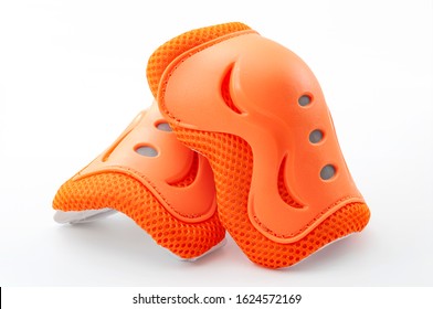 Cycling Safety Equipment, Extreme Sports And Bicycle Riding Gear Conceptual Idea With Orange Knee Pads Isolated On White Background With Clipping Path Cutout