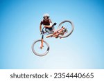 Cycling, sky and a man jump outdoor for sports, workout or training with skills and stunt. Athlete or cyclist with safety, wellness and fitness or performance space with balance and bicycle in air