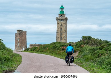 Cycling Towards The Lighthouse Of Cap Frehel On Eurovelo 4, Bretagne, France.