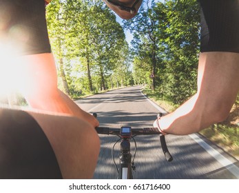 Cycling Training POV. Young Adult Athlete Riding A Racing Bicycle On A Sunny Spring Or Summer Afternoon. Personal Perspective