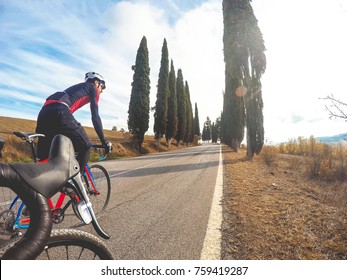 Cycling In Tuscany. Pair Of Cyclists Enjoy A Ride Bike.