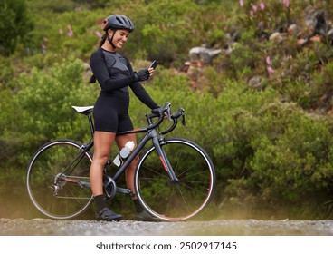 Cycling, woman or bicycle with smartphone in nature for navigation app, tracking workout progress or reading notification. Athlete, person or happy with phone on bike for cardio exercise and location - Powered by Shutterstock