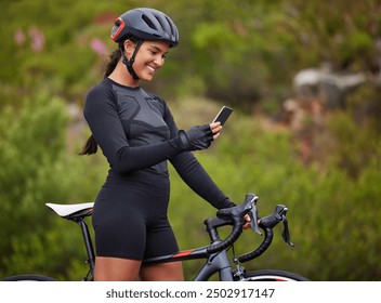 Cycling, woman or bike with phone in nature for navigation app, tracking workout progress or reading notification. Athlete, person or happy with smartphone on bicycle for cardio exercise or direction - Powered by Shutterstock