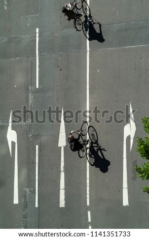 Similar – richtungsweisend | Straßenmarkierung Moped-Parkplatz