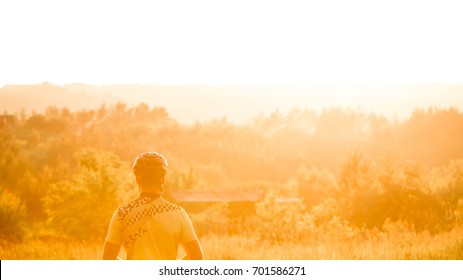Cyclist admires sunset. Beautifu frontal light after rain. - Shutterstock ID 701586271