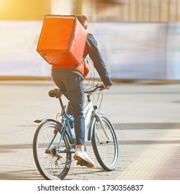 Cyclist Delivering Food. Courier On Bike With Thermal Backpack, Food Delivery. Fast Delivery Of Food By Bicycle