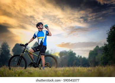 Cyclist Is Drinking Water From The Sport Bottle