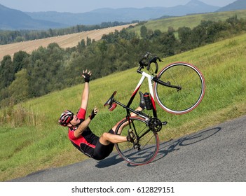 Cyclist falls off the bike on a steep slope. Accident on the road. Biker fall from the bike on asphalt way. Accident man in sports.