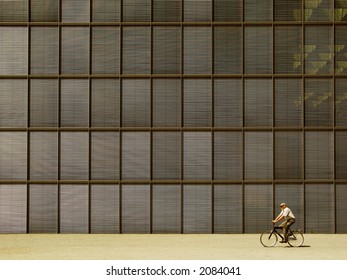 Cyclist in Front of Building