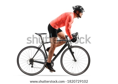 Cyclist with helmet and sunglasses riding a bicycle out of the saddle isolated on white background
