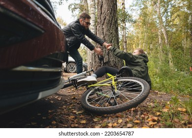 Cyclist Hit By Car Accident. Driver Man While Parking Knocked Down A Woman On Bike.