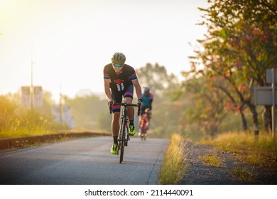 cyclist leads in action,Front view man riding bicycle in the morning
