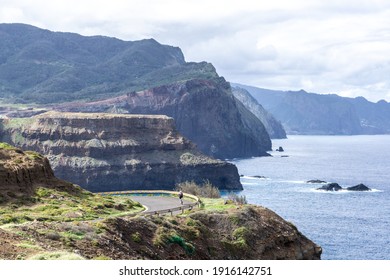 Cyclist On Cliffside Road With Beatiful Sea Panorama 