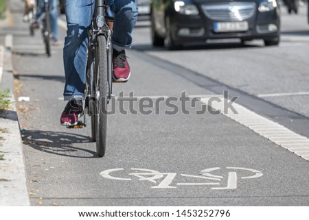 cyclist on lane with symbol