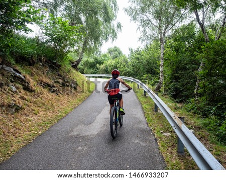 Similar – Radfahrer auf Waldweg