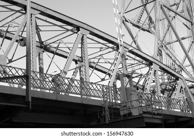 A Cyclist on a Steel Bridge