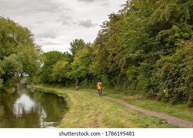 Cyclist On The Towpath Of The Trent And Mersey Canal At Stenson Near Derby