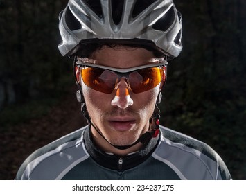 Cyclist Portrait With Flash Light In A Forest Outdoors