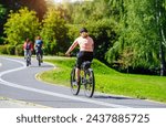 Cyclist ride on the bike path in the city Park 