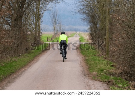 Similar – Radfahrer auf Waldweg