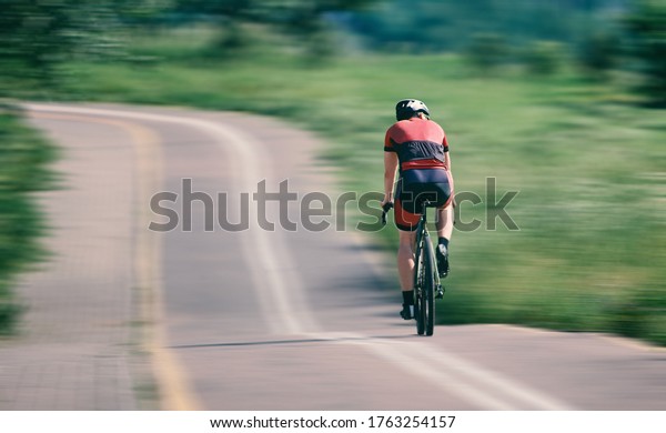 cyclist rides a\
bicycle fast. cycling. speed\
race