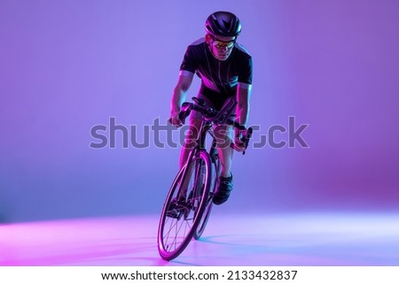 Man on bicycle preparing for triathlon race