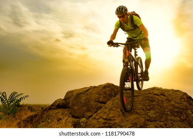 Cyclist Riding the Bike on the Autumn Rocky Trail at Sunset. Extreme Sport and Enduro Biking Concept. - Shutterstock ID 1181790478