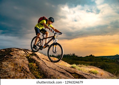 Cyclist Riding the Mountain Bike on the Rocky Trail at Sunset. Extreme Sport and Enduro Biking Concept. - Shutterstock ID 1296324679