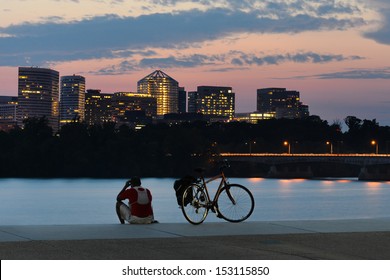 Cyclist silhouette and Rosslyn skyscrapers at sunset in Washington DC - United States