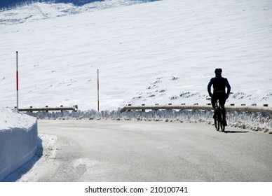 cyclist in a snowy road