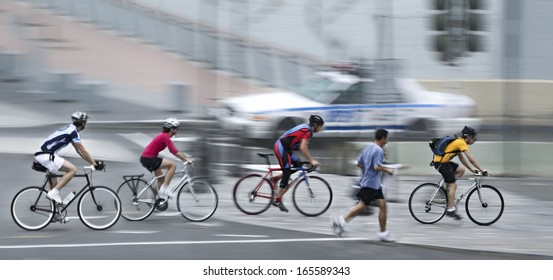 Cyclist In Traffic On The City Roadway  Motion Blur 