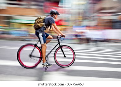 Cyclist In Traffic On The City Roadway  Motion Blur