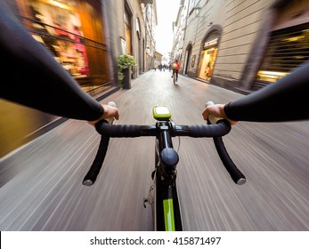 cyclist in traffic on the city roadway motion blur. POV Original point of view