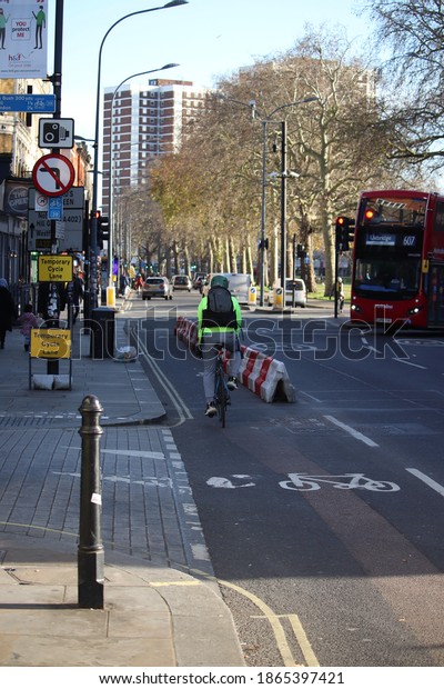 Cyclist using temporary cycle lanes in Shepherds
Bush London UK December
2020