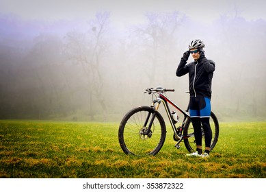 Cyclists adjusts glasses and preparing for training. Bad weather. - Powered by Shutterstock