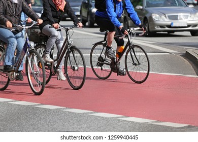 Cyclists On Red Cycle Lane