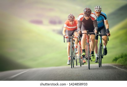 Cyclists out racing along country lanes in the mountains in the United Kingdom.