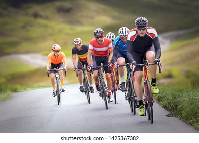 Cyclists out racing along country lanes in the mountains in the United Kingdom. - Shutterstock ID 1425367382