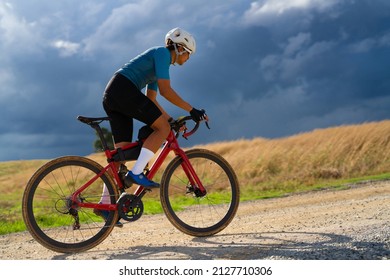 Cyclists practicing on gravel roads  in bad weather day - Shutterstock ID 2127710306