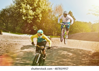 Cyclists Riding On Dirt Bike Course