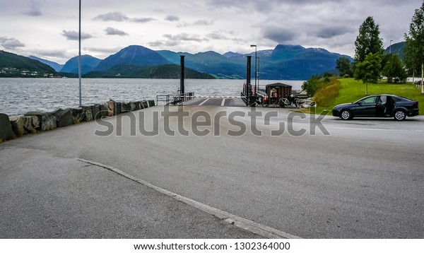 Cyclists traveling in the mountains of Norway.\
Waiting for the ferry
