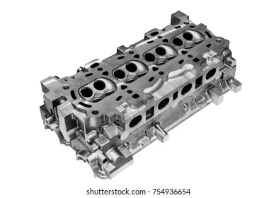 The cylinder head of the internal combustion engine. Isolated on white background. Alluminium casting.