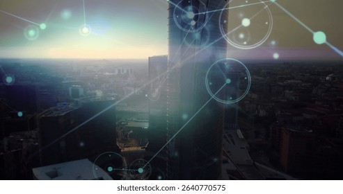 Cylindrical glass skyscraper and rectangular tower glowing at dusk in skyline, with network overlay. Skyscraper, urban, futuristic, digital, network, cityscape, technology