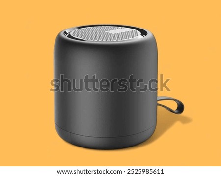 Cylindrical shape black bluetooth speaker on the orange background