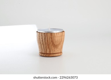 Cylindrical tealight candle holder made of walnut wood