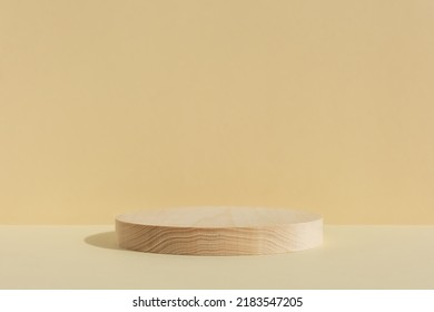 Cylindrical wooden scene on beige background. Premium podium for advertising your product. Minimal backdrop for product presentation. Showcase, display case. Soft focus - Shutterstock ID 2183547205