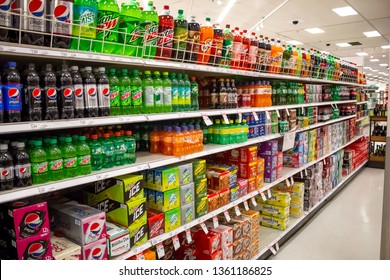 Cypress, California/United States - 03/19/19: The Soda Aisle Of A Grocery Store, Featuring Several Brands And Colors Of Carbonated Beverages