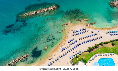 Cyprus Holiday Resort. Clear Blue Waters, Beach Drone Above. Beach Umbrellas, Mediterranean Sea